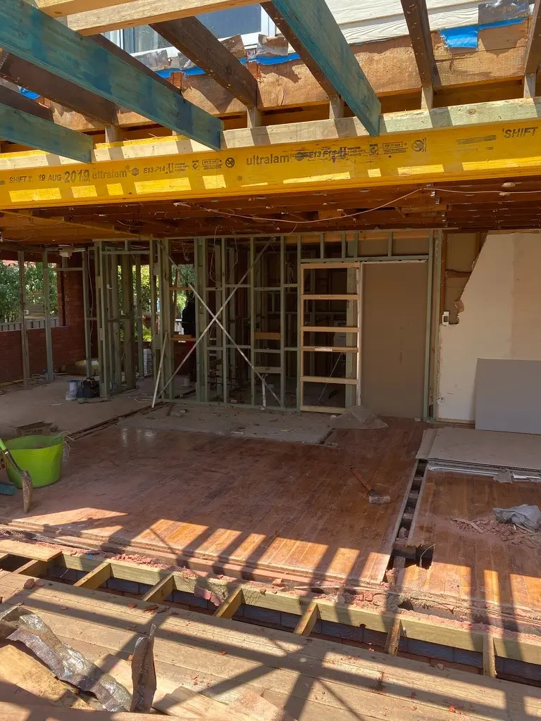 Structural walls removed and subfloor framing taking shape